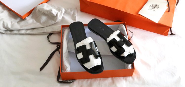 black hermes oran sandals
