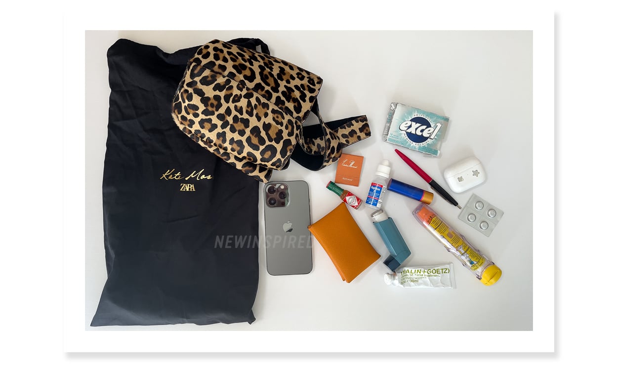 Showing what fits in the Kate Moss x Zara animal print bag: iPhone, card case, ventolin, epipen, gum, and a few other things